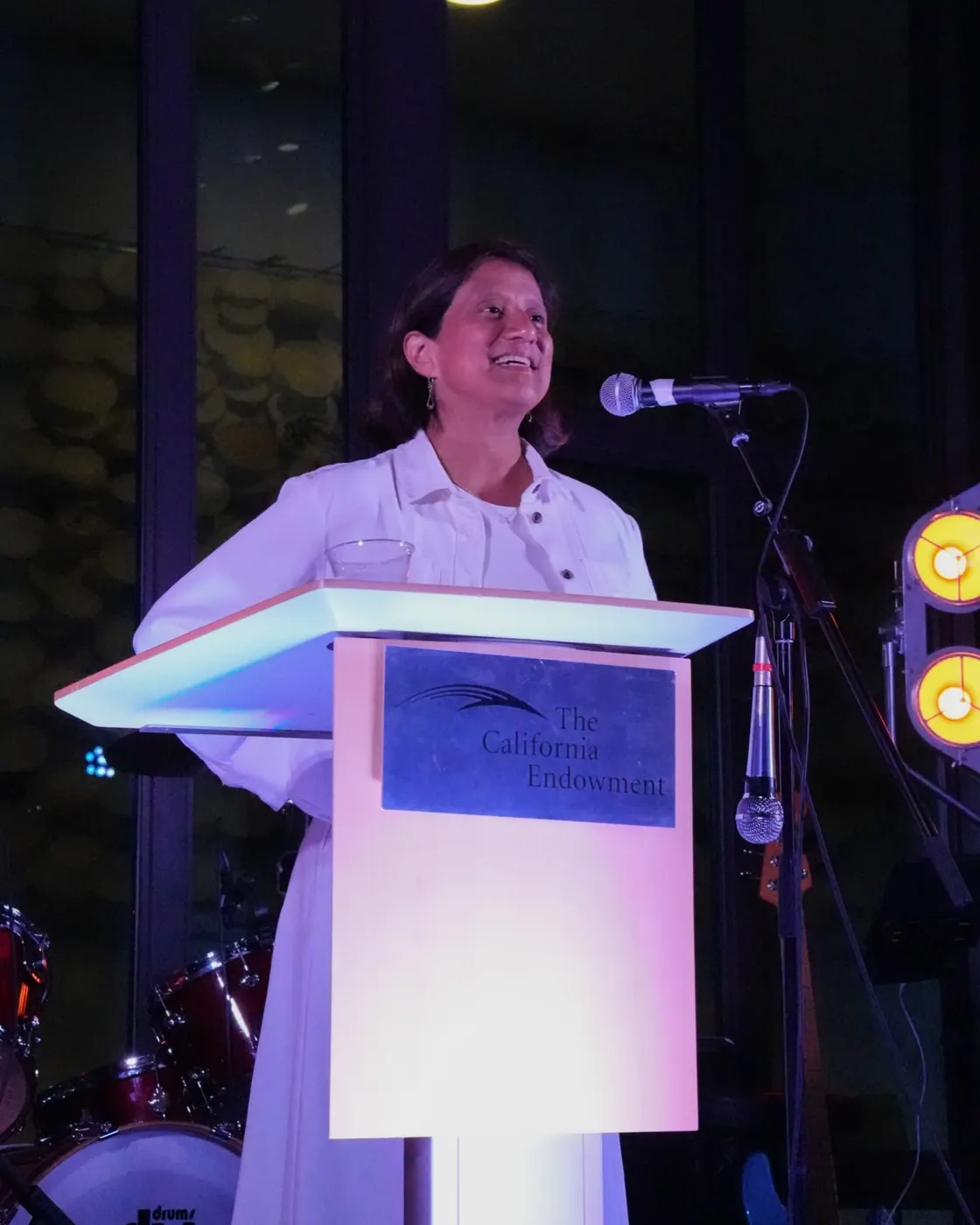 A speaker opens the evening’s program