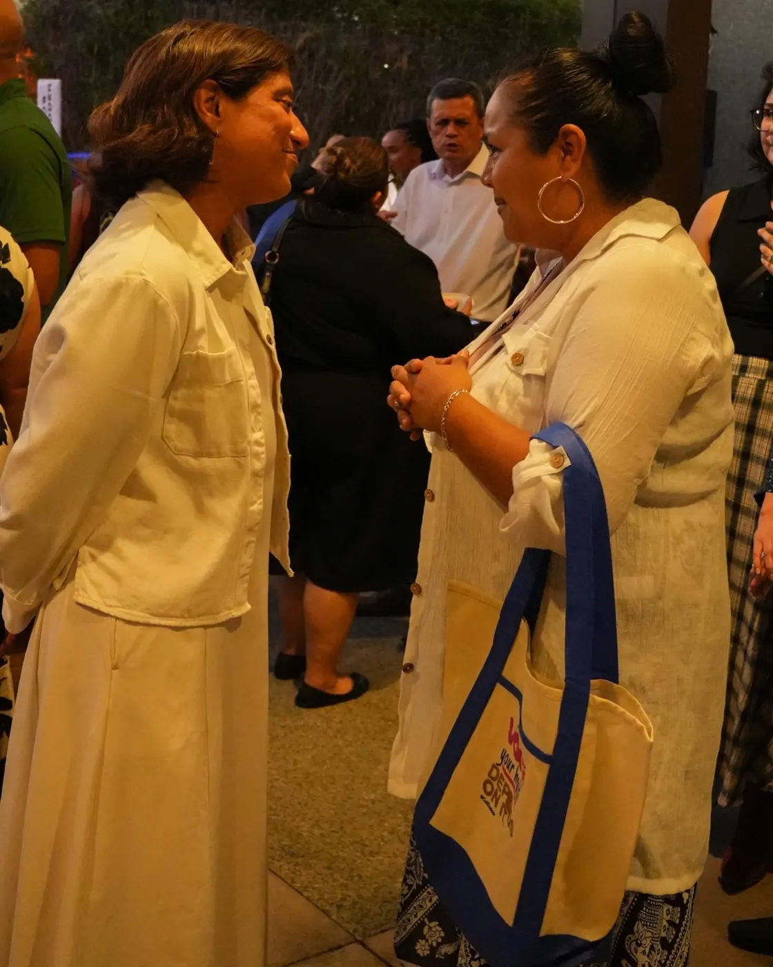 Two guests in conversation before the program