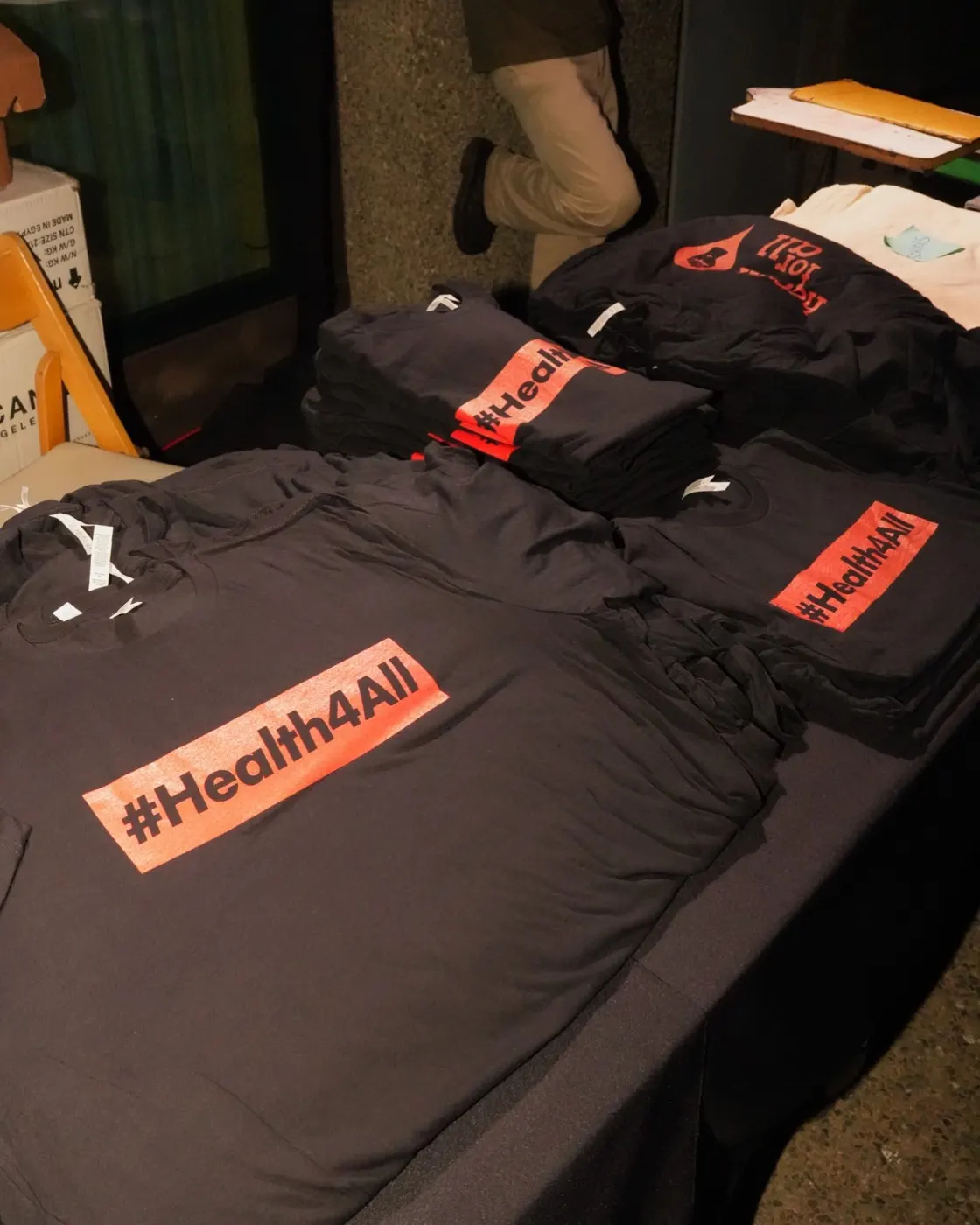 Health4All shirts laid out for guests